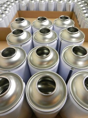 Aerosol cans awaiting filling in factory