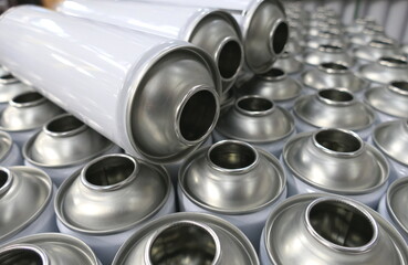 Empty aerosol cans in production factory