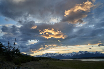Moody sunset with dramatic clouds over the landscape of lago roca at Perito Moreno glacier in glacier national park in Patagonia, Argentina in south America with snow covered mountains of the Andes