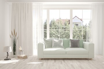White living room with sofa and summer landscape in window. Scandinavian interior design. 3D illustration