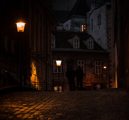  silhouettes walking in the night in Vienna old city center