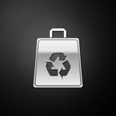 Silver Paper shopping bag with recycle icon isolated on black background. Bag with recycling symbol. Long shadow style. Vector.