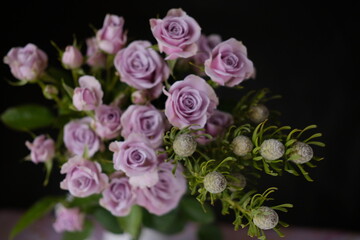 small rosebuds in a vase . flower shop