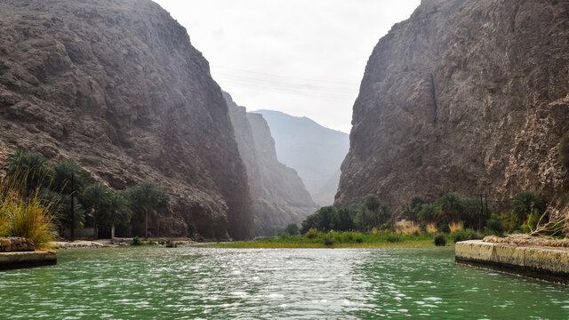 River that passes between the mountains, on the way to Wadi Shab, Oman.
