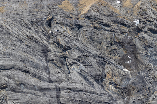 Different layers or geological folds in alpine rock developped during folding of the sediments or ductile deformation, Kandersteg Switzerland.