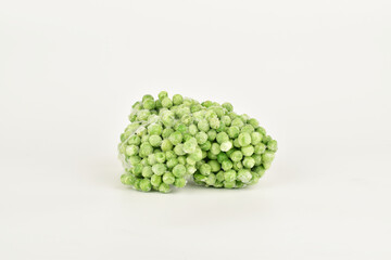 frozen peas stack on white background