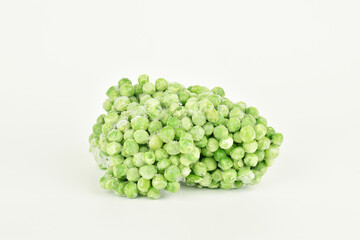 stack of frozen peas isolated on white background
