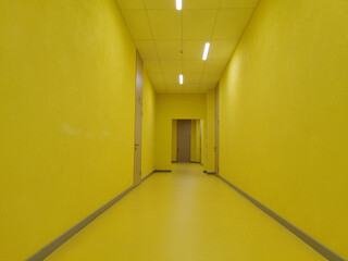 yellow corridor with lamps of a building