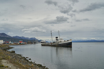 ship wreck lying at the coast line of tierra del fuego at hte port of Ushuia, Patagonia. Abandoned places