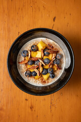Oats with mangos and blueberries