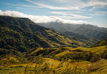 Obraz premium Landscape from Monte Verde in Costa Rica, mountains and green forests, rainforest and bue sky with the clouds
