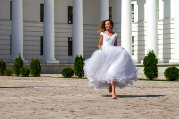 Young beautiful girl in ballroom prom dress © Andrey_Arkusha