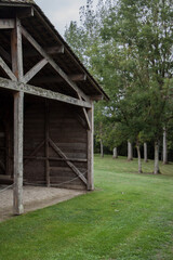 
Wooden construction of a hangar. Roof and wall of a hangar in the rural area.
