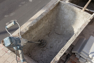 Cement Launder at a construction site. Cement tank for construction. Concrete work at a construction site. Tank for supplying concrete mortar to floors during building construction