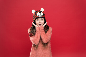 Bright memories. happy teen girl wear warm clothes. feel comfortable and cozy in any weather. winter holiday and vacation. kid in hat with ear flaps. child in knitted sweater. happy childhood