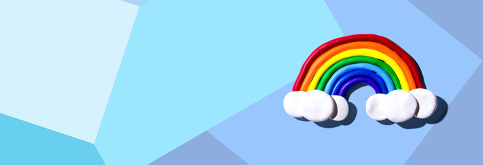 Rainbow and white clouds made with clay - overhead view