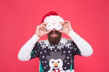 Ho Ho Ho. happy new year. merry christmas. cheerful bearded man in santa hat and sweater. brutal hipster celebrate xmas party. winter holiday preparations. buy new year tree decoration