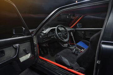 Fototapeta na wymiar sports car interior with roll cage and drift handbrake night photography
