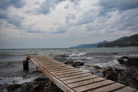 wooden bridge leading to the sea