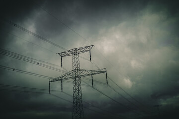 silhouette of transmission towers, power tower, electricity pylon, steel lattice tower at twilight...