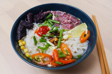 Vietnamese Fo-Bo soup with rice noodles and beef