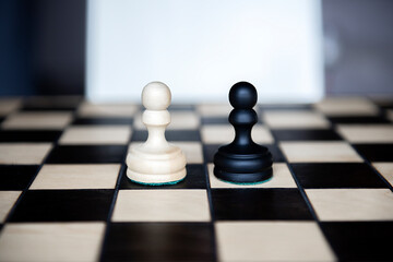 Chess pieces-two equally powerful adversaries facing each other