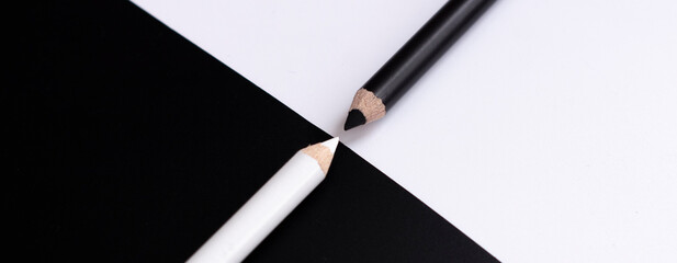 white and black pencils on white and black background. Anti-fire abstraction