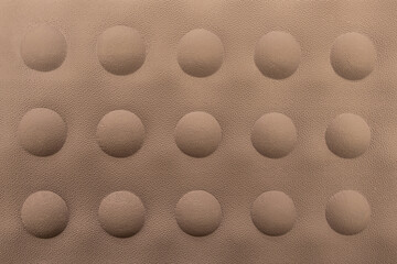 abstract background of beige embossed plastic surface close up