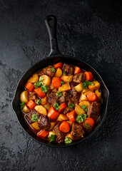Beef Stew with carrot and baby potato in iron cast pan