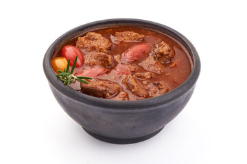 Beef goulash soup, isolated on white background