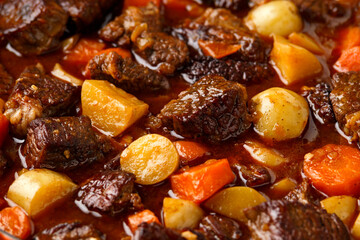 Beef Stew with carrot and baby potato in iron cast pan