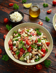 Bean Salad with Cherry Tomatoes, Cucumber, Red onion, Feta cheese and parsley. Healthy vegetarian, vegan diet food