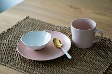 Rose dishes on a wooden table