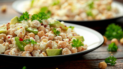 Chickpeas salad with feta cheese, avocado and herbs. healthy food