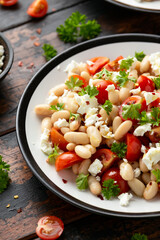 White Bean Salad with Cherry Tomatoes, Feta cheese and parsley. Healthy vegetarian, vegan food
