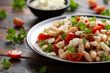 White Bean Salad with Cherry Tomatoes, Feta cheese and parsley. Healthy vegetarian, vegan food