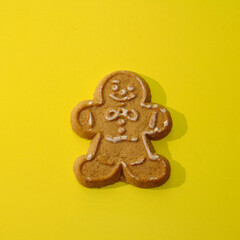 Gingerbread person on yellow background 