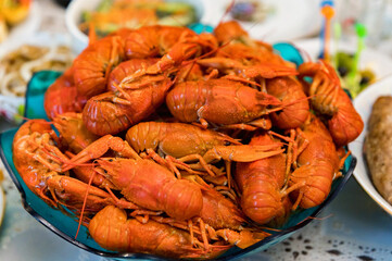 Close up of cooked crayfishes in plate on table