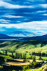 Fototapeta na wymiar Green valley with a mountain lake