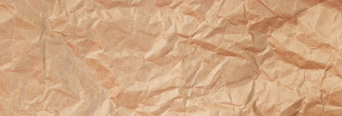 Background of crumpled craft paper for packaging. Banner