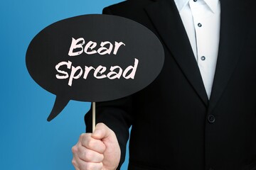Bear Spread. Businessman holds speech bubble in his hand. Handwritten Word/Text on sign.
