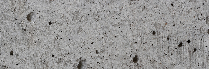 Texture of old concrete wall. Rough grey concrete surface. Wide panoramic background for design.