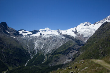 Fototapeta na wymiar Glacier in Saas Fee, seen from a hill