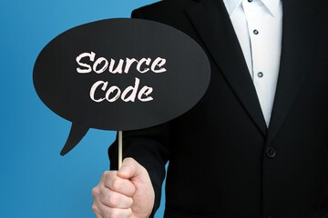Source Code. Businessman holds speech bubble in his hand. Handwritten Word/Text on sign.
