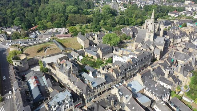 Flight over the city Guingamp and Basilica of Our Lady of Merciful on summer day. France