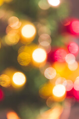 Christmas tree seasonal background glowing multicolored lights, blurred image