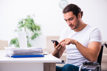 Young disabled man working from house