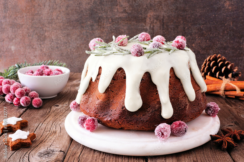 Poster christmas gingerbread cake with eggnog cream cheese frosting and wreath of snowy rosemary and cranbe
