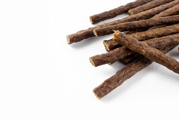 a group of natural formed dog treats, beef, chicken, pork, lamb meat sticks on white background