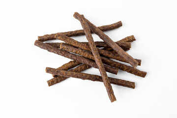 a group of natural formed dog treats, beef, chicken, pork, lamb meat sticks on white background